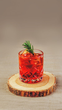 Bright cocktail on a wooden stand