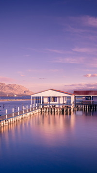 Small fishing houses on stilts on the lake Mesologgi