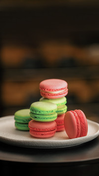 A pyramid of delicious colored macaroons on rotating surface