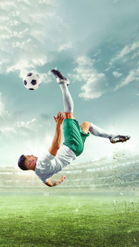 Soccer athlete icking ball in mid air for winning goal