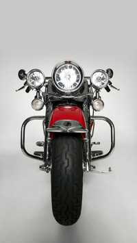 Large red motorbike in studio front view