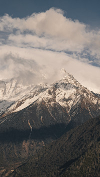 The wondrous peaks of the snowy region shine in the sunlight
