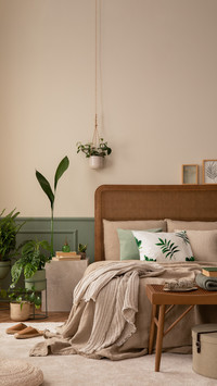 Warm and cozy bedroom interior with mock up poster frame