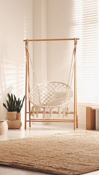 Comfortable hammock chair in stylish room