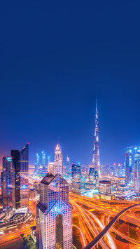 Modern Dubai skyline after the sunset with city center light
