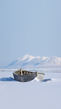 Arctic, frozen old wooden boat