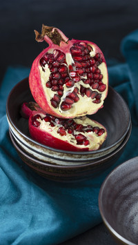 Eating pomegranate in autumn