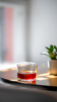 Side view of black filter coffee in Hario cup on cafe table