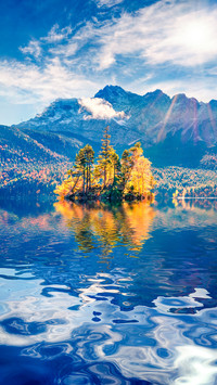 Zugspitze reflected in the waters of Eibsee lake in Germany