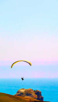 Lone paraglider above cliff in Sonoma Coast State Park