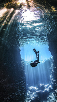 Diver under Sea in Cave