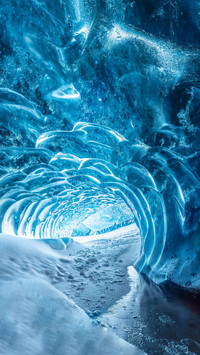 Blue crystal ice cave entrance and an underground river