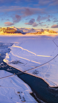 The golden mountains bathed in sunlight in iceland 2