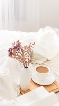 Breakfast on dark wooden vintage tray in bed