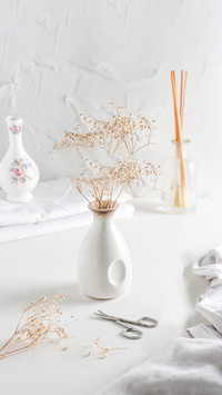 Flower in a white vase. Bright mood