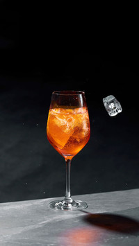 A refreshing cocktail in a glass with ice cubes
