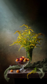 Still life with raspberries and a bouquet of flowers