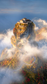 Aerial photography of red clouds and golden summit shrouded
