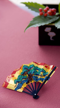Japanese folding fan and plant in square box