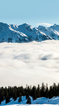 Clouds and mist surround the mountains