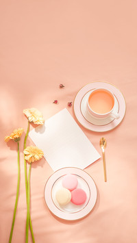 Envelope, Flowers, and Macarons with Cup of Tea