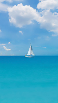 A Sailboat in Blue Turquoise Seawater