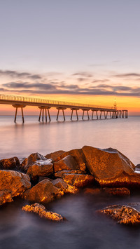 The sea pier of Badalona in Spain before sunrise