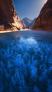 Ice-cold lake glows in the cold sky