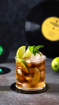 Cuba Libre drink with lime and ice