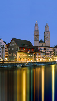 Buildings at the waterfront grossmunster cathedral zurich