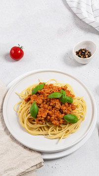Italian pasta with meat, tomato sauce and vegetables