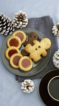 A set of cookies next to christmas decoration