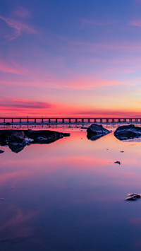 A pinkishpurple sky mirror