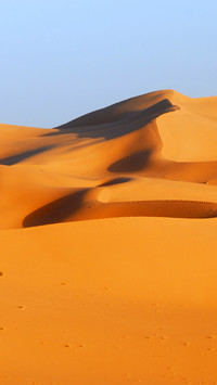 The desert is clouded and the sky is vast