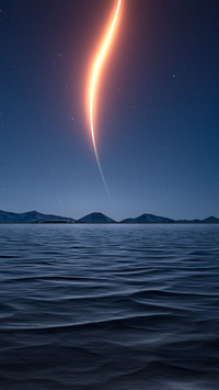 A glimmer of fire in the blue starry sky