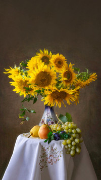 Still life with sunflowers and fruits