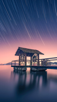 The calm lake surface beneath the star's orbit