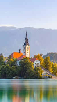 Nature scenery from Julien Alps with church near water