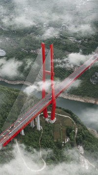 Yachi river bridge under clouds and mists