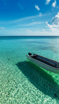 A small boat floating in the sea