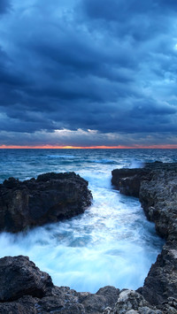 Storm in sea bay and dark sky