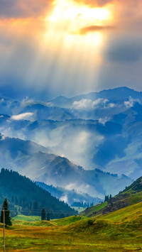 The setting sun shines upon the tianshan mountains