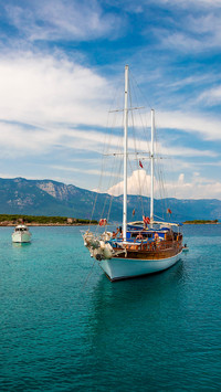 Peaceful Haven, White and Blue Ship Against Azure Sky