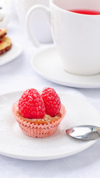 Delicious fresh berry cake with tea