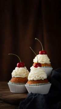 A vertical shot of delicious cupcakes
