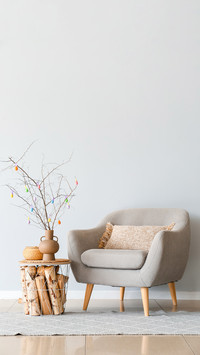 Tree branches with colorful Easter eggs on table