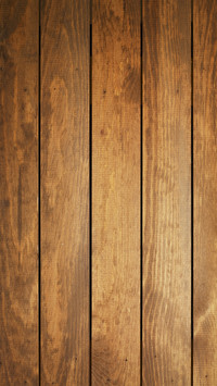 Overhead view of light brown wooden table