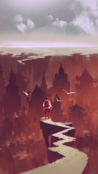 Man standing on rock path looking at the buried city