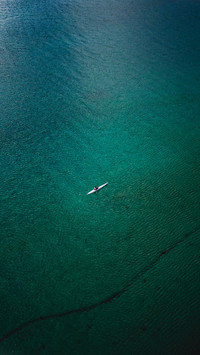 Man padeling in the North of Norway