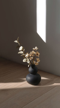 Elegant black vase with a bouquet of flowers